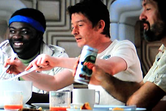Kane, with Parker and Dallas, enjoys a hearty meal after his experience. All seems well. But something nasty is about to befall the crew ...