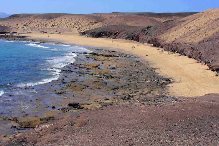 And the view from the red-tinted headland looking down on to Caleta del Congrio and along towards the south west