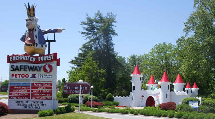 Old King Cole Guards the entrance to what is now a shopping center.