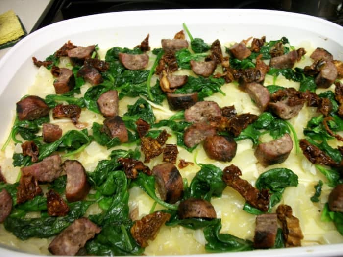 Layer spinach and brats over egg and bread mixture. Then top with remaining egg and cheese. I like brat slices in scrambled eggs too.