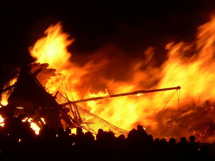 A Norse Longship is burned during the Edinburgh Hogmanay festival, where the Up Helly Aa "vikings" of Orkney help lead the procession with torches.