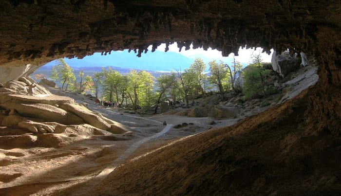 Cueva del Milodon entrance from inside. A life-sized statue of Mylodon stands to the far left.