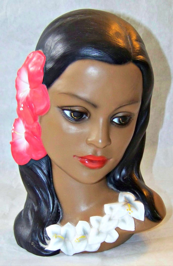She has a remarkable detailed, a lovely flower lei, and two awesome red hibiscus flowers in her hair. This masterpiece from Japan is in excellent condition, with beautiful, and carefully hand painted features,