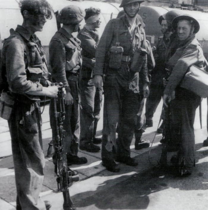 Men of Commander Ian Fleming's No 3 Commando disembark at Newhaven after being transported back from Dieppe