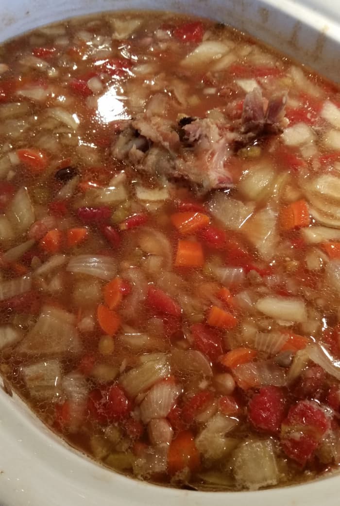 Stir the bits of ham back into the soup. If you want it to have more meat, cut up some chunks of ham to add. The soup is done when the beans are soft, not crunchy.
