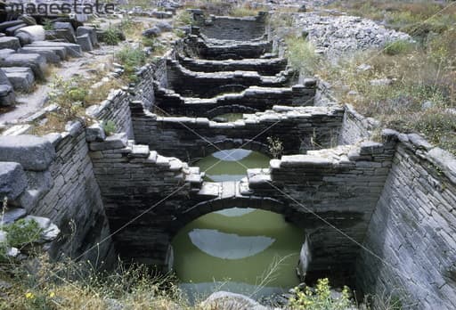 Aqueduct, Delos, Greece. Remains of an Ancient Greek water course on the island of Delos. Artist: Unknown