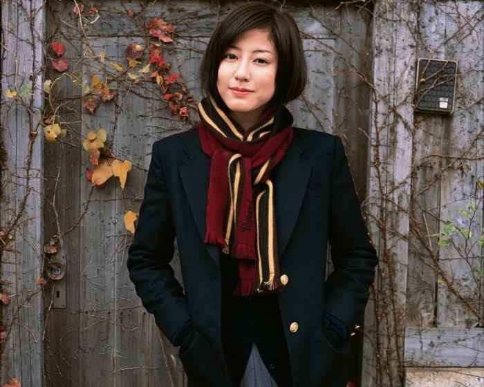 Supermodel Yumi Sugimoto of Osaka is seen here dressed in a very business like Japanese style uniform. This is one of the things that these models are required to do.
