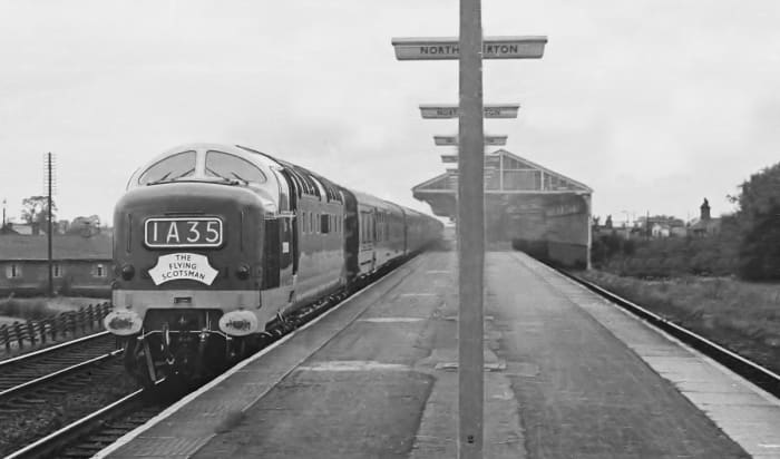 A new era ushered in... unidentified Deltic diesel bears the nameplate for the Down 'Flying Scotsman' service (10 am from Kings Cross, London) on her way non-stop through Northallerton. Nearest stopping point was Darlington (Up or Down)