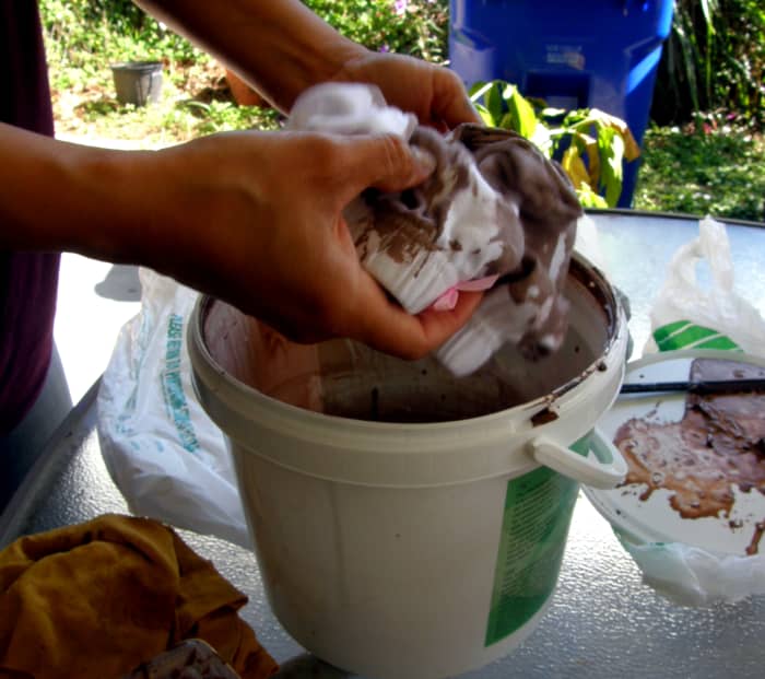 Remove the bags and set them aside, as you will need them shortly after this step. I then began to dip the pants into the Paverpol mixture, being very careful to get it covered, both inside and out. It must be saturated, but not dripping wet.