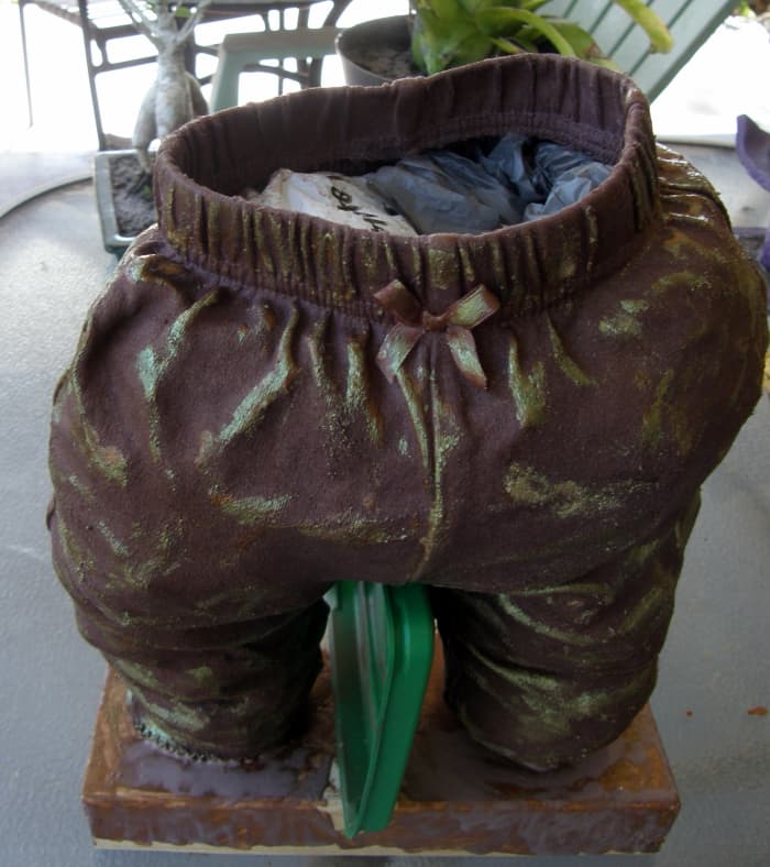The sculpture is completely dry in this image and I have started to add some color using powdered pigments. The bags will be removed when completely dry. Paverpol does not stick to plastic, so they will come out relatively easily.