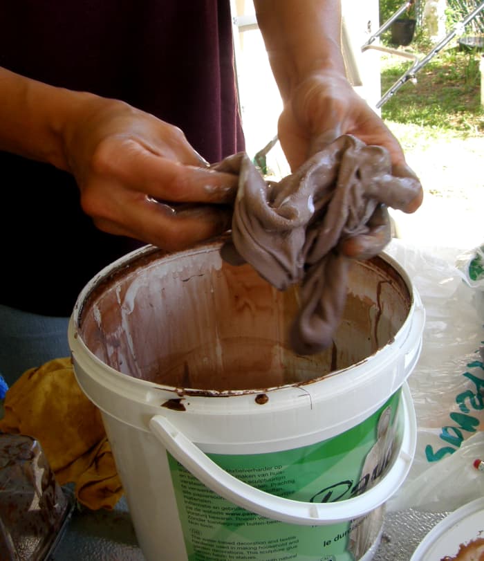 Here the pants is fairly covered in the Paverpol. Keep manipulating the material to ensure full coverage. You don't want the sculpture to dry and discover white spots.