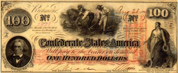 A $100.00 Confederate States of America Currency made in 1862. With a portraiture of J.C. Calhoun to the left, and slaves hoeing in the center of the note. The Confederacy goddess is portrayed on the right.