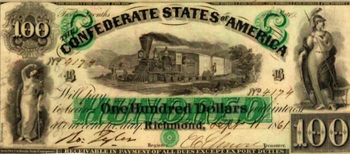 A 1861 One Hundred Dollar Confederate States of America bill, printed in Richmond Virginia and hand signed.