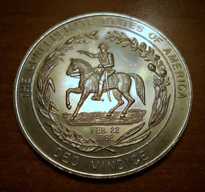 A 1862 Confederate Fifty Cents Coin, God will prove us right. Deo Vindice (motto of the Confederate States of America) "God Will Vindicate"