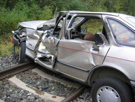 Don's Ford Escort was crushed by an eighteen wheeler, pinning his legs under the dashboard. Jaws of Life were required to free him from the wreckage. (Not the actual wreckage photo.)