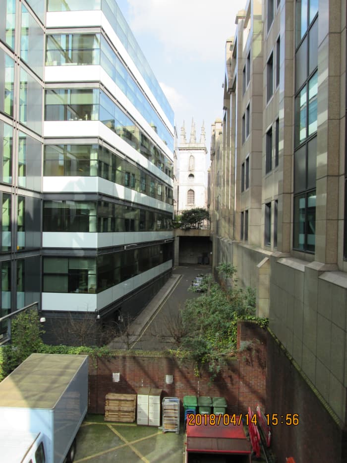 Between towers of steel, glass and concrete we catch another glimpse of the tower of St Mary Somerset