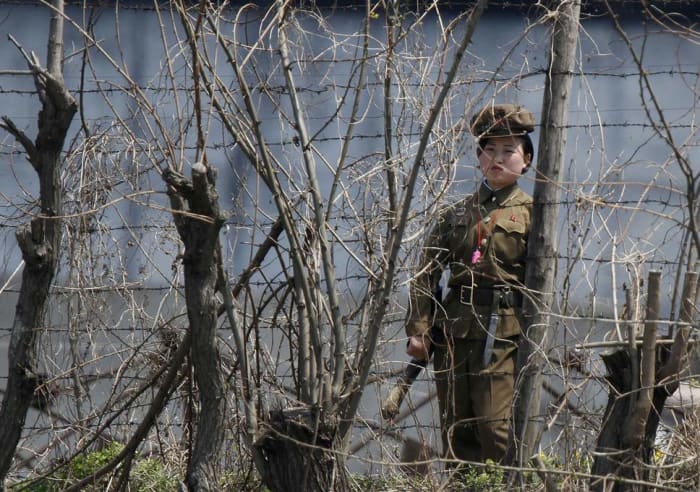 A North Korean guard stands watch over a concentration camp that does not officially exist.
