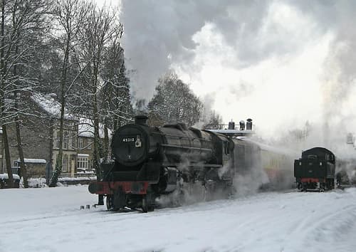 The scene looks right, sort of... Since when did Santa arrive driving an ex-LMS Class 5? What happened to faithful old Rudolph? He's in the brake van? Oh, that's all right then