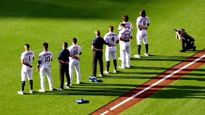 A view of some of the Houston Astros players on the field including former Astros player Carlos Correa who is pictured on the far left.