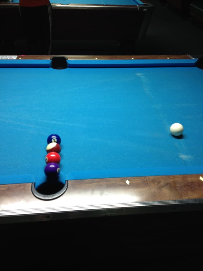 The balls must be "frozen" to each other and the ball next to the side pocket must be as close as possible.