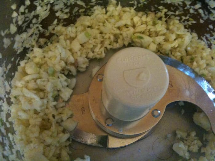 Use a food processor to process the garlic to just about this size - far easier than mincing by knife, especially when you're using a lot!