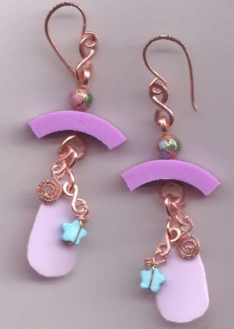 A little bit of plastic, a rubber ring from a Target Pharmacy bottle, a little stone star and some copper trim and you're good to go.