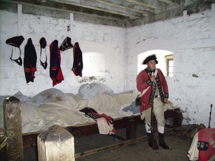 Actor dressed in uniform of an enlisted colonial soldier in French Castle in Old Ft. Niagara.