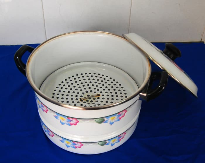 This simple single tier steamer has an enamel surface and I've been using it for more than 35 years.