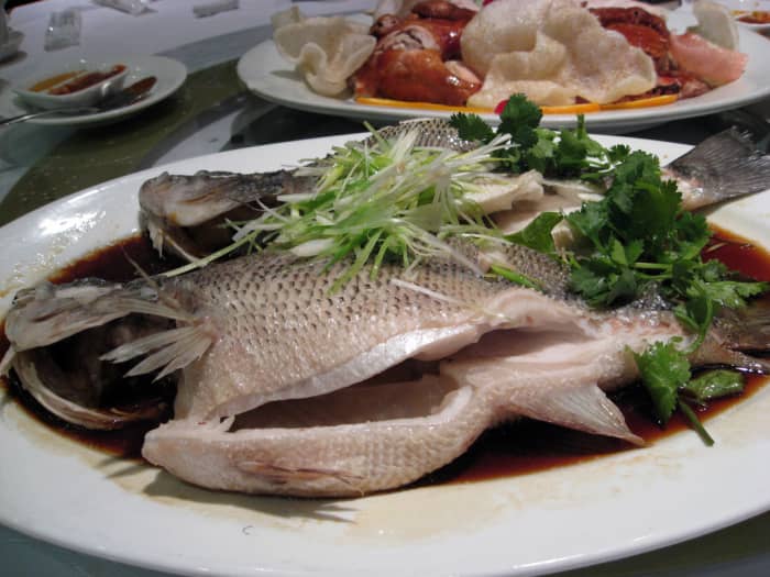 The Chinese love to eat steamed fish with just some light soy sauce and garnished with chopped spring onions and celery.