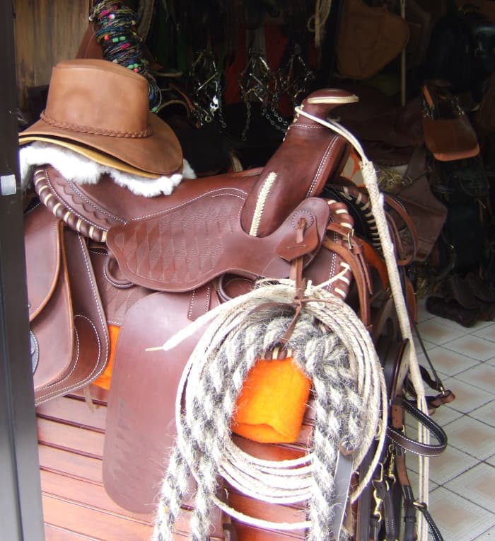 Beautiful handmade saddles in a Cotacachi shop, along with hats, horsehair lassos, and other equestrian items.