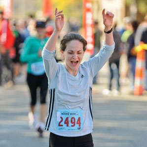 This is me crossing the finish line at MY FIRST RACE, a half-marathon--The Captial City River Run in Lansing, MI on September 26, 2010. My official time was 2:08:51.