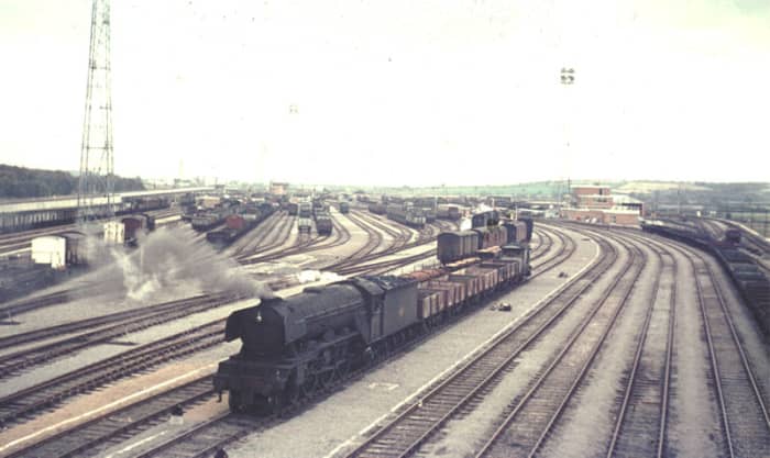 Lamesley (Tyne) Yard adjacent to the ECML on its west side suffered the same fate as Erimus, also built too late to achieve value. A grimy A3 brings empties past