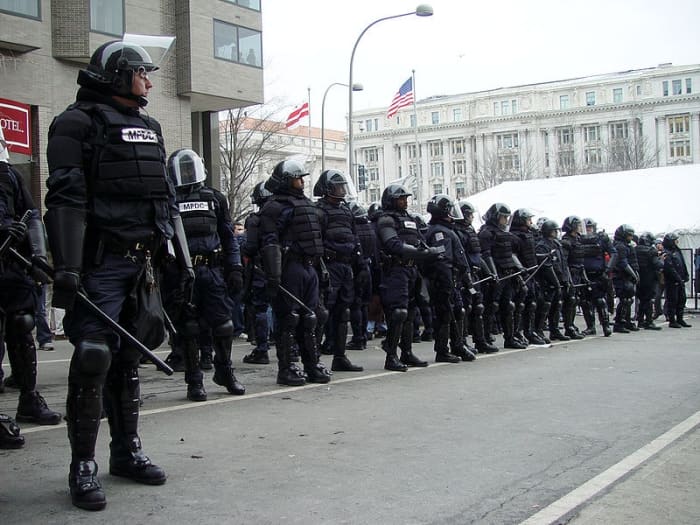 Police in riot gear blocking a checkpoint into the parade route at Bush's 2nd inauguration, Washington DC. 20 January 2005