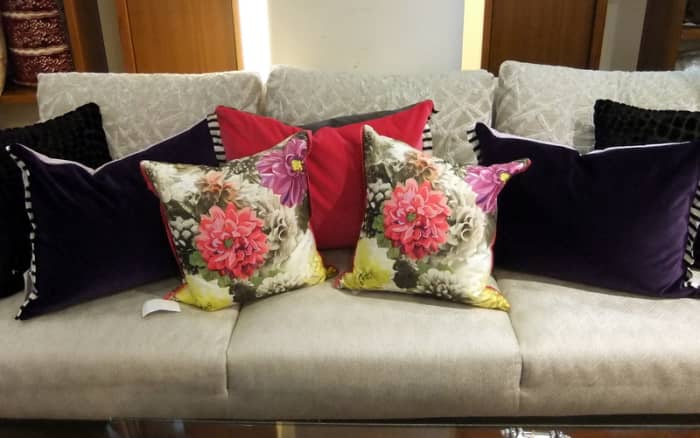 3. Throw cushions or pillows come in different patterns and shapes. Pick an anchor color and use them well.