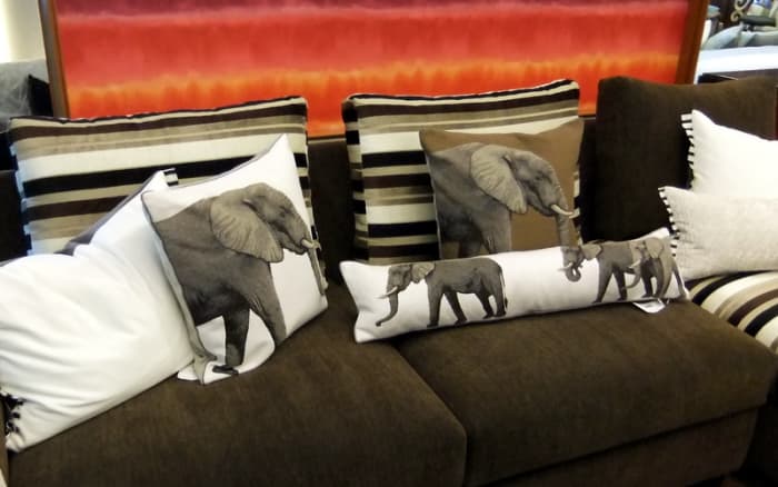 7. Use different sizes and shapes for throw pillows, when you decorate your room. If you are bored with geometric patterns, try animal design!