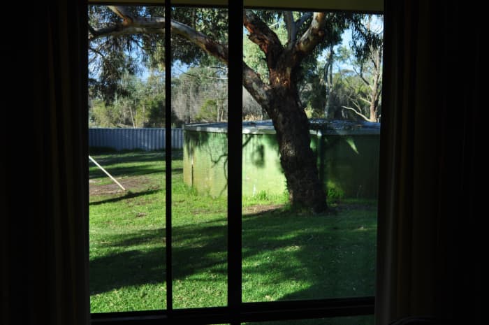 I took her hand and invited her inside. She checked my room and noticed the rusty water tank in our backyard through my window.