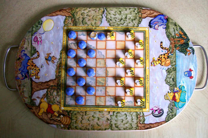 Winnie the Pooh & Friends checker board painted by Patty Sypek ~ she made this unique piece using the flip side of a wooden cutting board. The moving pieces are little bumble bees and honey pots with removable lids.