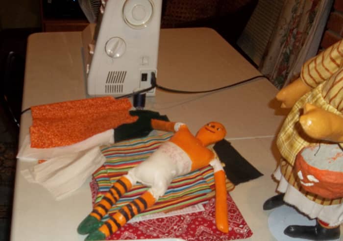 Sybil's work room was filled with remnants of dolls, doll clothing, fabric, and the sewing machine she used to put them all together.