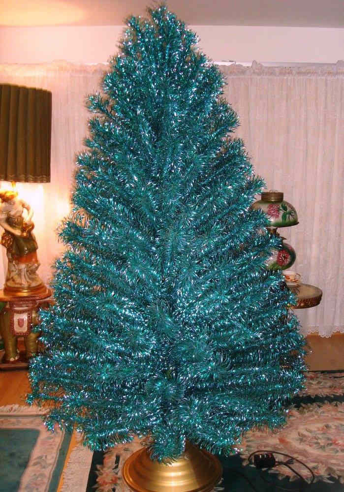 The vintage emerald green blue seven foot stainless aluminum Holiday Christmas tree. This is a most have for a true vintage tree lover.