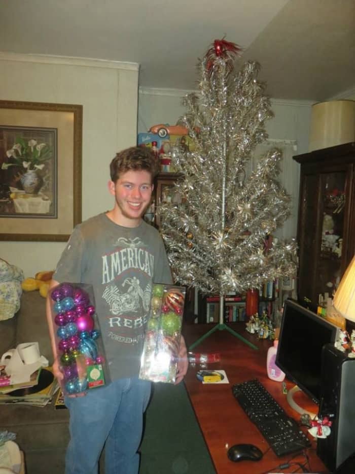 Grantley putting up our Splendor Stainless Aluminum Christmas Tree in our Man Cave upstairs, The tree was made by in 1960 by the R.O. Kent in New York, made in the USA.