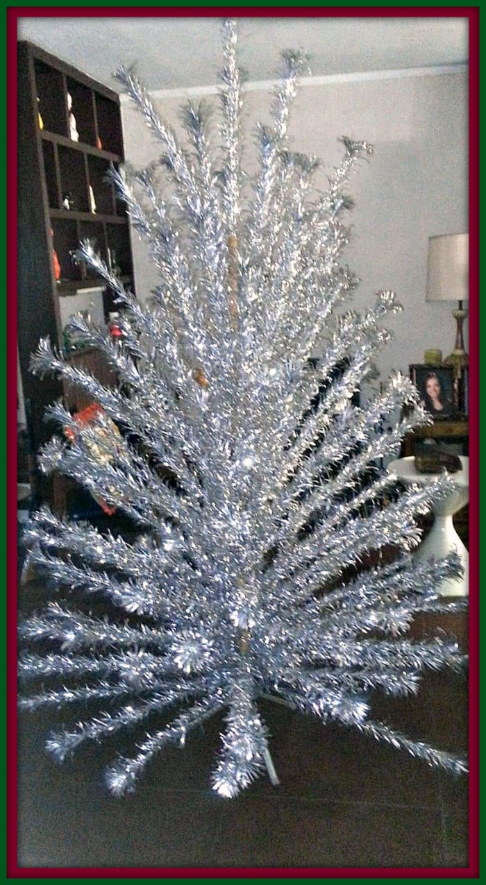 A vintage, mid-century 8 foot Evergleam 121 branch silver stainless aluminum fountain Pom Pom Christmas tree. This is a beautiful blast from the past ...