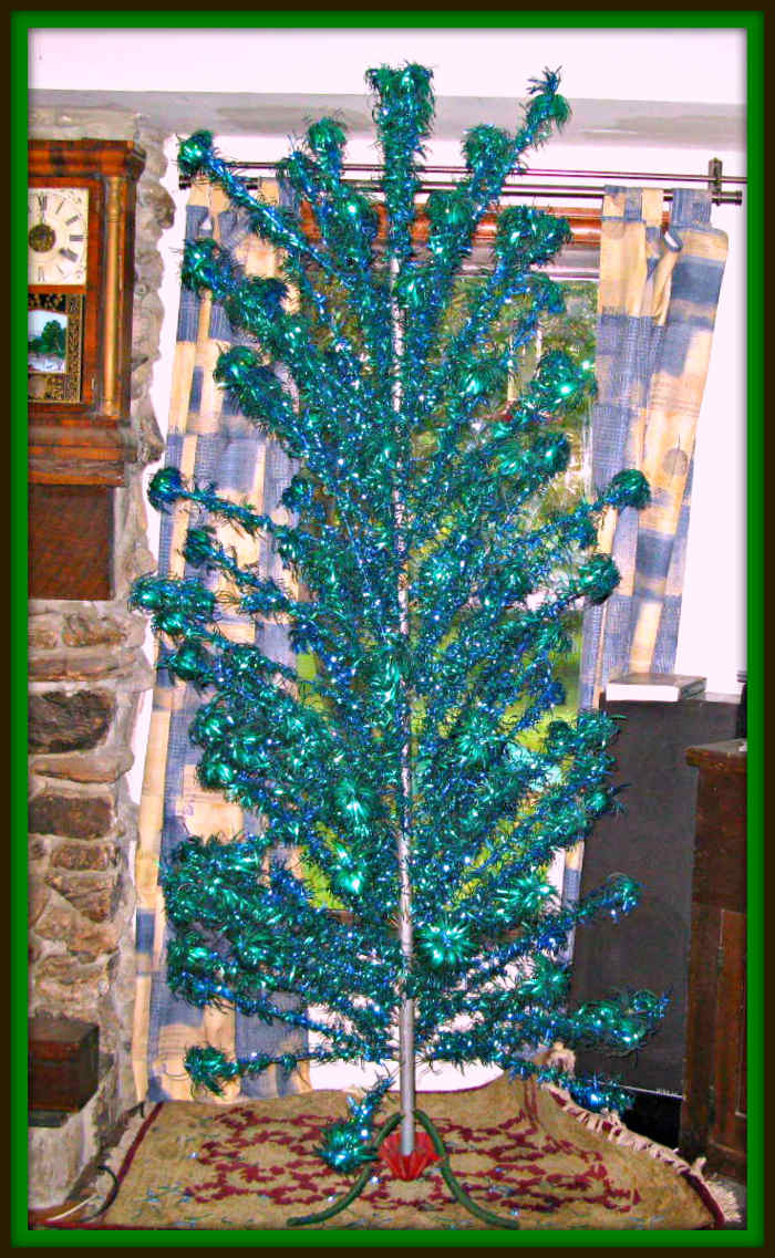 This tree is 92 inches tall from the bottom of the stand to the top of tree with small branch that sticks in top. There are 114 branches. Pom Pom Silver Forest Aluminium Christmas Tree 7 1/2' beautiful blue and green colors ...
