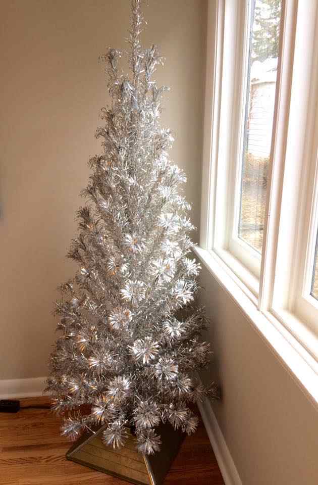 An early 1960s beauty, the Evergleam 121 branch "Slim Line" model aluminum tree I own. I think it looks good enough to leave with out decorations, this model was made for folks with limited space, such as apartment dwellers, and is very well made.