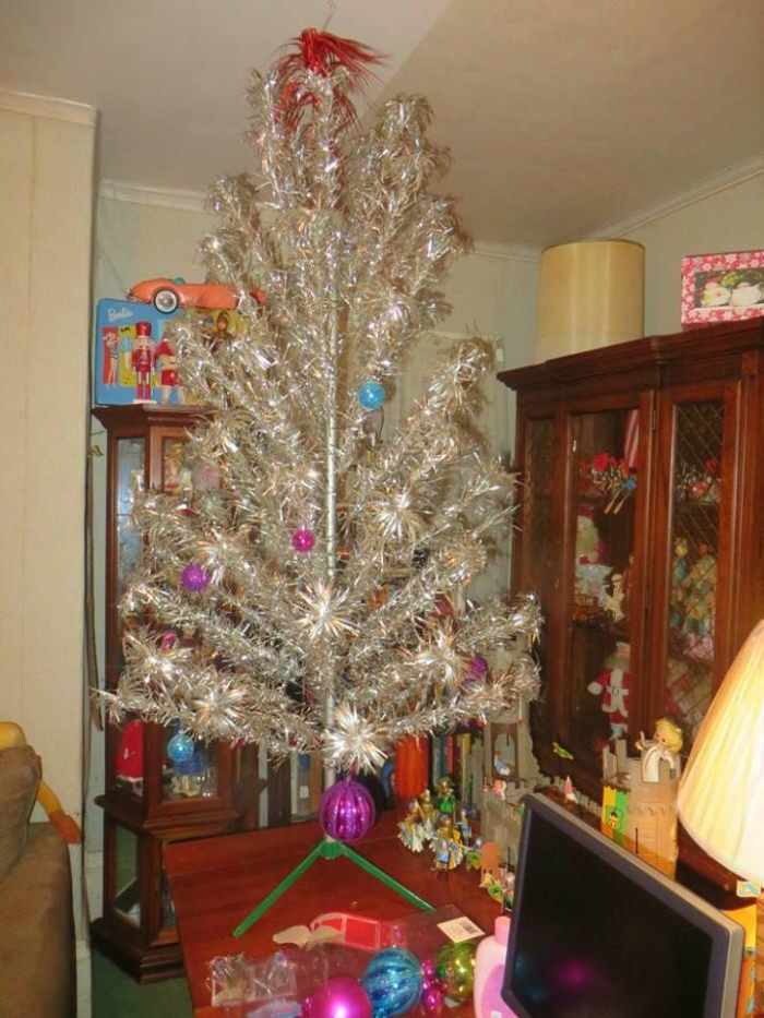Grantley putting up our Splendor Stainless Aluminum Christmas Tree in our Man Cave upstairs, The tree was made by in 1960 by the R.O. Kent in New York, made in the USA.
