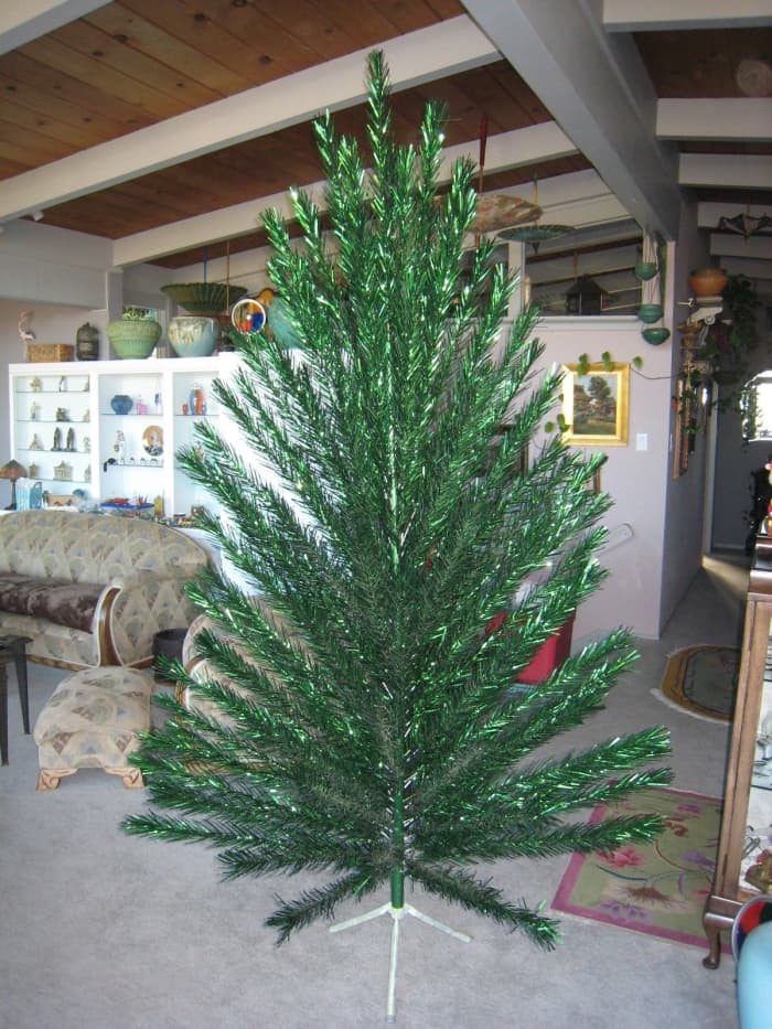 A vintage Evergleam green 8FT. taper Christmas tree with 124 branches. The condition is as good as we have ever seen on one of these aluminum trees.