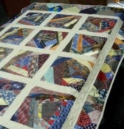 Crazy quilting is my absolute favorite kind of quilting and it makes for hours of fun simply looking at how the patterns (or lack of patterns) come together. This crazy quilt is a very fun use of neckties, made more crazy with a variety of patterns.