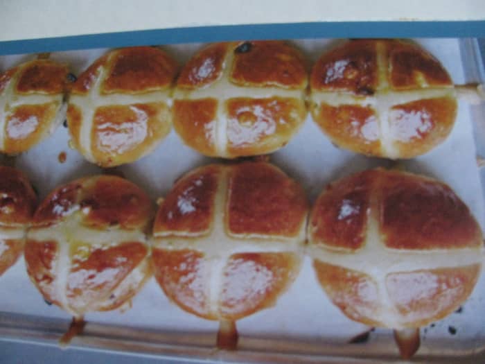 Glazed hot cross buns for Good Friday, flavoured with sultanas & cinnamon and crossed with pastry.