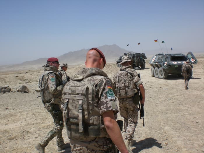 These ISAF soldiers have their heads down and are looking despondent. A long, drawn out war in Afghanistan has exhausted not only US soldiers but Afghans as well.