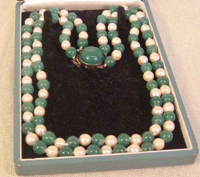 This Japanese vintage cultured pearl and jade double strand necklace would date to the early side of the 20th century between 1920's and 1952, when this silver marked was used.