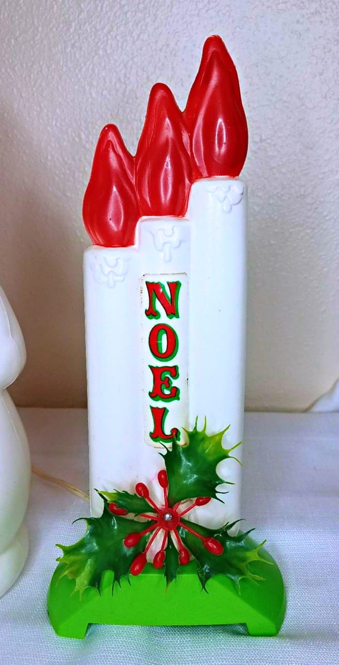 Lovely vintage Empire Plastics Christmas Blow Mold NOEL Candles with Holly trim at the base, this precious window display is 13 inches tall, and comes with its own bulb and cord that inserts inside the base.
